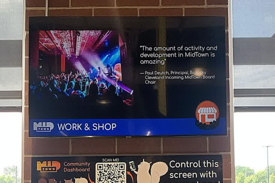 Above the checkout at Dave's Market in MidTown Cleveland, with a code to control the screen by phone